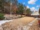 Backyard with stone pathway and partially snow covered grass at 3578 Crayton Glen Way, Buford, GA 30519