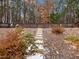 Stone steps lead up to a wooded area in the backyard at 3578 Crayton Glen Way, Buford, GA 30519