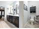 Double vanity bathroom with toilet and linen cabinet at 3578 Crayton Glen Way, Buford, GA 30519