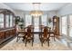 Elegant dining room with hardwood floors, chandelier, and large windows at 3578 Crayton Glen Way, Buford, GA 30519