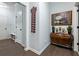 Bright entryway with hardwood floors, coat rack and bench at 3578 Crayton Glen Way, Buford, GA 30519