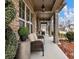 Front porch with wicker chairs and decorative planters at 3578 Crayton Glen Way, Buford, GA 30519