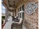 Front porch with wicker chairs and wall decor at 3578 Crayton Glen Way, Buford, GA 30519