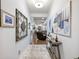 Hallway with wall art and view into living area at 3578 Crayton Glen Way, Buford, GA 30519