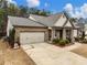 Two-story house with a three-car garage and manicured lawn at 3578 Crayton Glen Way, Buford, GA 30519