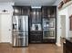 Kitchen boasts stainless steel appliances and ample dark cabinetry at 3578 Crayton Glen Way, Buford, GA 30519