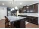 Modern kitchen with dark cabinetry, granite countertops, and stainless steel appliances at 3578 Crayton Glen Way, Buford, GA 30519