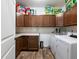 Laundry room with washer, dryer and upper cabinets at 3578 Crayton Glen Way, Buford, GA 30519