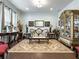 Elegant living room with ornate furniture and area rug at 3578 Crayton Glen Way, Buford, GA 30519