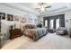 Spacious main bedroom with a king-size bed and sitting area at 3578 Crayton Glen Way, Buford, GA 30519