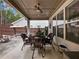 Covered patio with wicker furniture and a view of the backyard at 3578 Crayton Glen Way, Buford, GA 30519