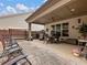 Covered patio with seating area, grill, and ceiling fan at 3578 Crayton Glen Way, Buford, GA 30519