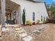 Landscaped side yard with stone steps leading to the patio at 3578 Crayton Glen Way, Buford, GA 30519