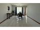 Formal dining room with tile floors and a glass-top dining table at 4053 Chapel Mill Bnd, Decatur, GA 30034