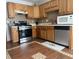 Kitchen features wood cabinets, stainless steel appliances, and tile flooring at 4053 Chapel Mill Bnd, Decatur, GA 30034