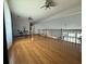 Spacious loft area with hardwood floors and a view of the living room at 4053 Chapel Mill Bnd, Decatur, GA 30034