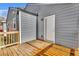 A wooden deck off the back of a house features a door and gray siding at 1271 Lorenzo Sw Dr, Atlanta, GA 30310