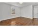 Bright bedroom with hardwood floors and large window at 1271 Lorenzo Sw Dr, Atlanta, GA 30310