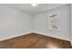 Bright bedroom with hardwood floors and large window at 1271 Lorenzo Sw Dr, Atlanta, GA 30310