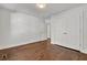 Bedroom features hardwood floors, closet, and a door to the hall, and lots of light at 1271 Lorenzo Sw Dr, Atlanta, GA 30310