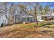 Charming gray house with a covered porch and mature trees in the front yard at 1271 Lorenzo Sw Dr, Atlanta, GA 30310