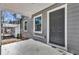 Inviting front porch with gray door and white trim at 1271 Lorenzo Sw Dr, Atlanta, GA 30310