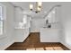 Modern kitchen featuring white cabinets, stainless steel appliances, ample counter space, and hardwood floors at 1271 Lorenzo Sw Dr, Atlanta, GA 30310