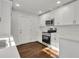 Renovated kitchen with white cabinets, stainless steel appliances, and hardwood floors at 1271 Lorenzo Sw Dr, Atlanta, GA 30310