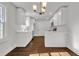 Modern eat-in kitchen with white cabinets, quartz countertops and island at 1271 Lorenzo Sw Dr, Atlanta, GA 30310