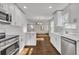 Spacious kitchen with white cabinets, quartz countertops and stainless steel appliances at 1271 Lorenzo Sw Dr, Atlanta, GA 30310