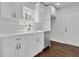 Modern kitchen with white cabinets, stainless steel appliances and a window above the sink at 1271 Lorenzo Sw Dr, Atlanta, GA 30310