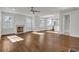 Bright living room featuring hardwood floors, a fireplace, and plenty of natural light from large windows at 1271 Lorenzo Sw Dr, Atlanta, GA 30310
