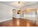 Open living room with hardwood floors, fireplace, and views of dining area at 2021 Lily Valley Dr, Lawrenceville, GA 30045