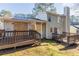 Backyard view featuring a deck and some damage to windows and doors at 3950 Fennel Sw Cir, Atlanta, GA 30331