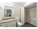 Bathroom featuring granite counters, tile flooring, and closet space at 3950 Fennel Sw Cir, Atlanta, GA 30331