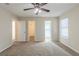 Bedroom featuring ceiling fan with doors to the bathroom and walk-in closet at 3950 Fennel Sw Cir, Atlanta, GA 30331