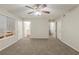 Bedroom with ceiling fan, neutral walls and doors to bathroom and staircase at 3950 Fennel Sw Cir, Atlanta, GA 30331
