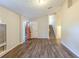 Inviting living room with wood-look floors, leading to a staircase and featuring a freshly painted entry door at 3950 Fennel Sw Cir, Atlanta, GA 30331