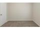 Neutral-colored room with door, walls, ceiling and carpet at 3950 Fennel Sw Cir, Atlanta, GA 30331
