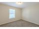Neutral-colored room with window, walls, ceiling and carpet at 3950 Fennel Sw Cir, Atlanta, GA 30331