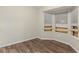 Sunlit room with wood-look floors and bay windows at 3950 Fennel Sw Cir, Atlanta, GA 30331