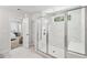 Large bathroom with a walk-in shower and marble tile at 2044 Garvin Rd, Acworth, GA 30101