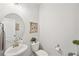 Simple and clean bathroom with a round mirror and single sink vanity at 2044 Garvin Rd, Acworth, GA 30101
