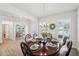Elegant dining room with a large table, chandelier, and hardwood floors at 2044 Garvin Rd, Acworth, GA 30101