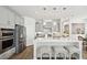 Open concept kitchen with white cabinets and a large island at 2044 Garvin Rd, Acworth, GA 30101