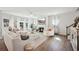 Open living room with hardwood floors, fireplace, and ample natural light at 2044 Garvin Rd, Acworth, GA 30101