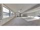 Finished basement with whitewashed walls and neutral carpeting at 2395 River Run Dr, Douglasville, GA 30135