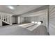 Finished basement recreational area with fireplace and built in shelving at 2395 River Run Dr, Douglasville, GA 30135