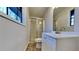 Updated bathroom with shower/tub combo and white vanity at 2395 River Run Dr, Douglasville, GA 30135