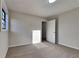 Spacious bedroom featuring neutral walls, carpet, and a large window at 2395 River Run Dr, Douglasville, GA 30135